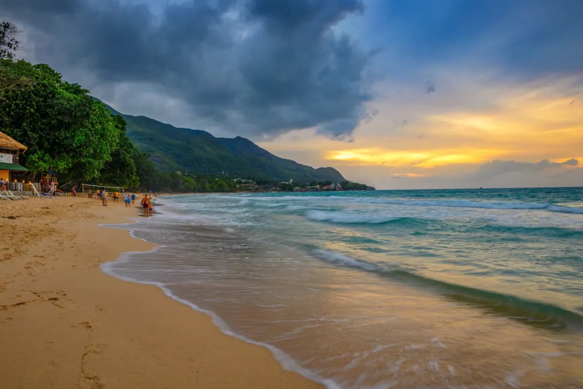 Beau Vallon Beach popular beach in Seychelles known for soft white sand, calm waters, sunsets, and water sports activities.