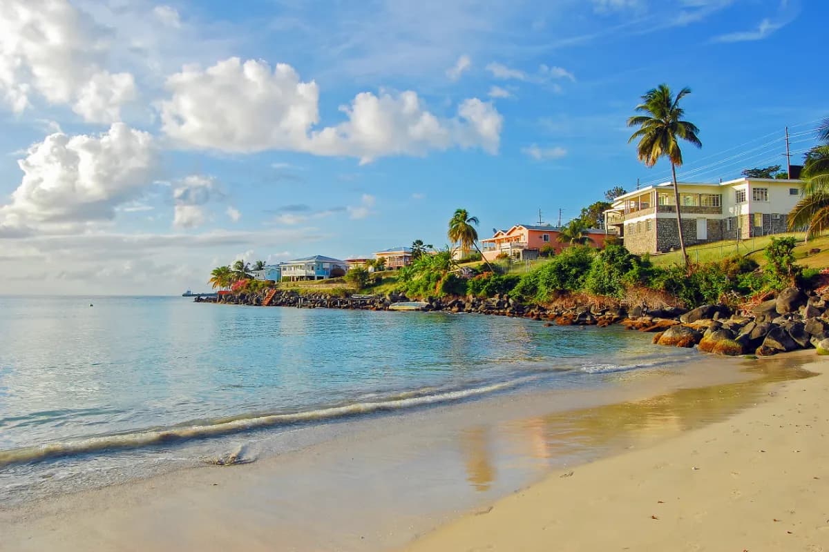 Grand Anse scenic beach in Seychelles known for wide white sands, powerful waves, and dramatic granite surroundings.