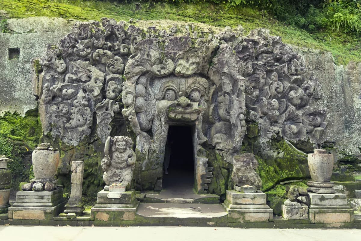 Goa Gajah historic temple complex in Bali famous for its carved stone gateway, ancient cave sanctuary, and rich cultural heritage.