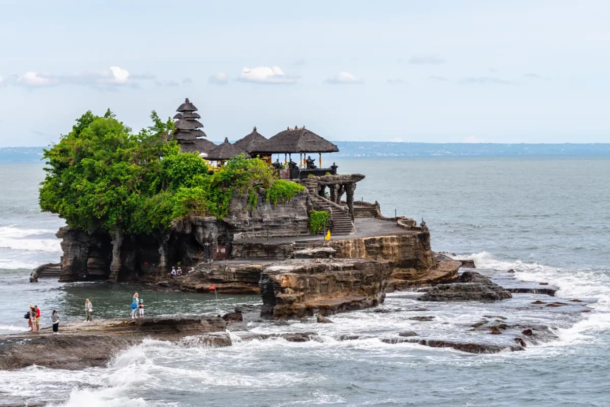 Tanah Lot iconic sea temple in Bali known for its dramatic coastal setting, ocean views, cultural significance, and spectacular sunsets.