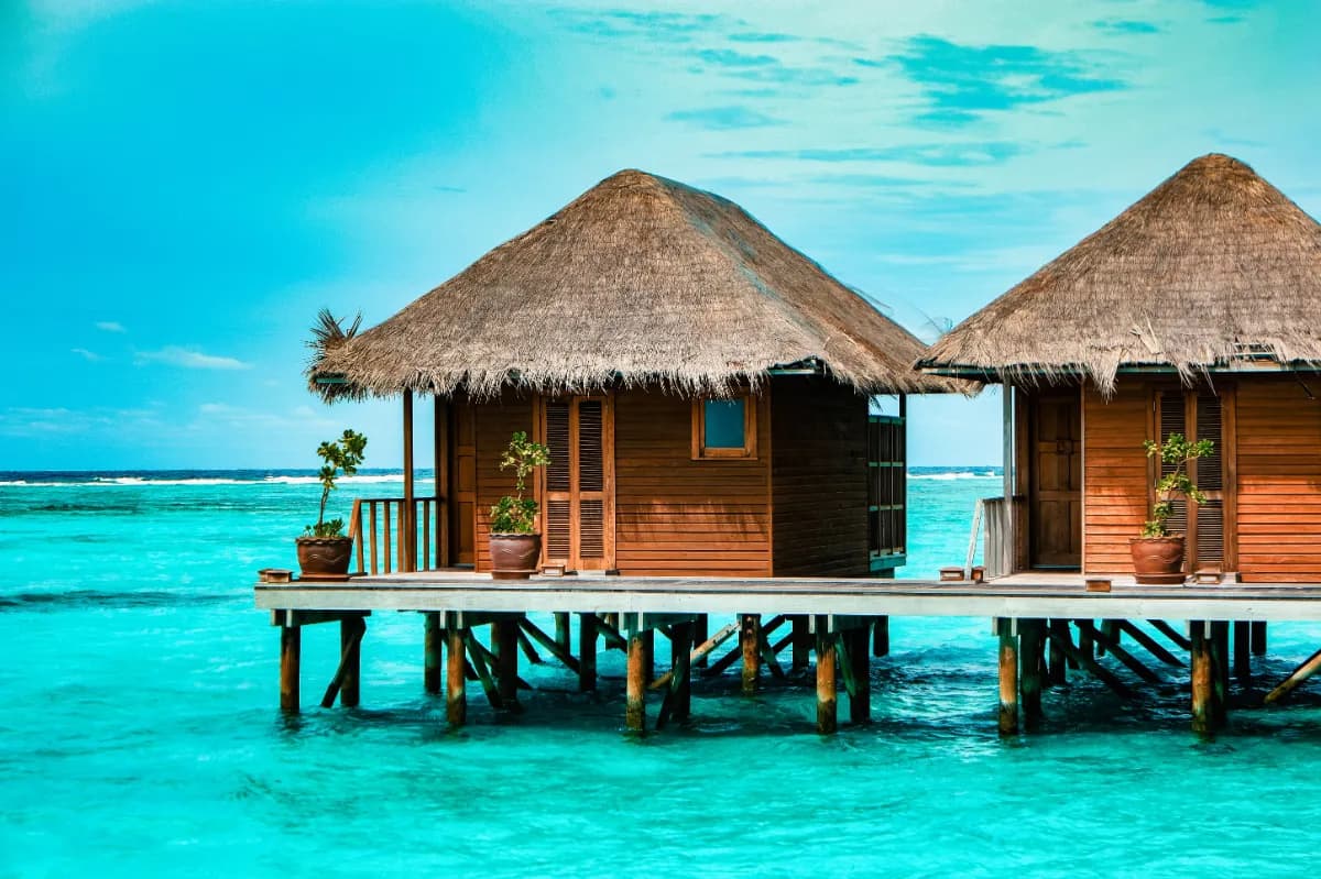Maldives idyllic tropical island nation known for crystal-clear lagoons, white-sand beaches, vibrant coral reefs, and luxury resorts.