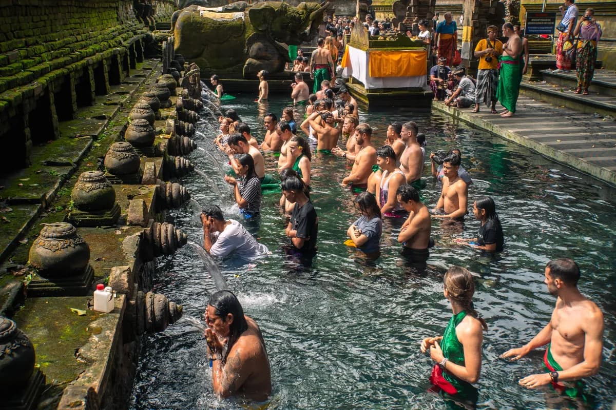 Tirta Empul sacred Hindu water temple in Bali where devotees participate in purification rituals using its revered holy spring waters.