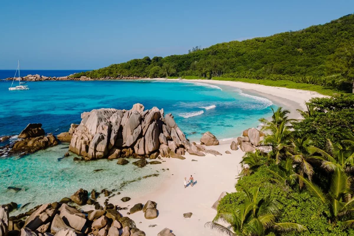 Anse Cocos secluded tropical beach in Seychelles known for clear turquoise waters, white sand, and natural granite rock scenery.