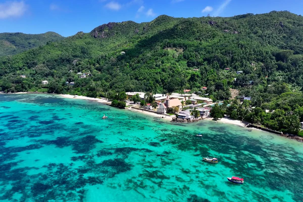 Beautiful view of Mahé Island near Victoria featuring tropical beaches, lush green hills, turquoise waters, and scenic coastal landscapes in Seychelles.