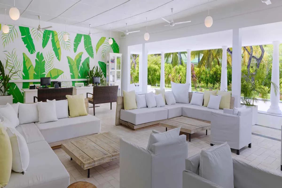 Equator Village charming beachfront resort in the Maldives known for tropical surroundings, comfortable accommodations, and easy access to diving and island adventures.