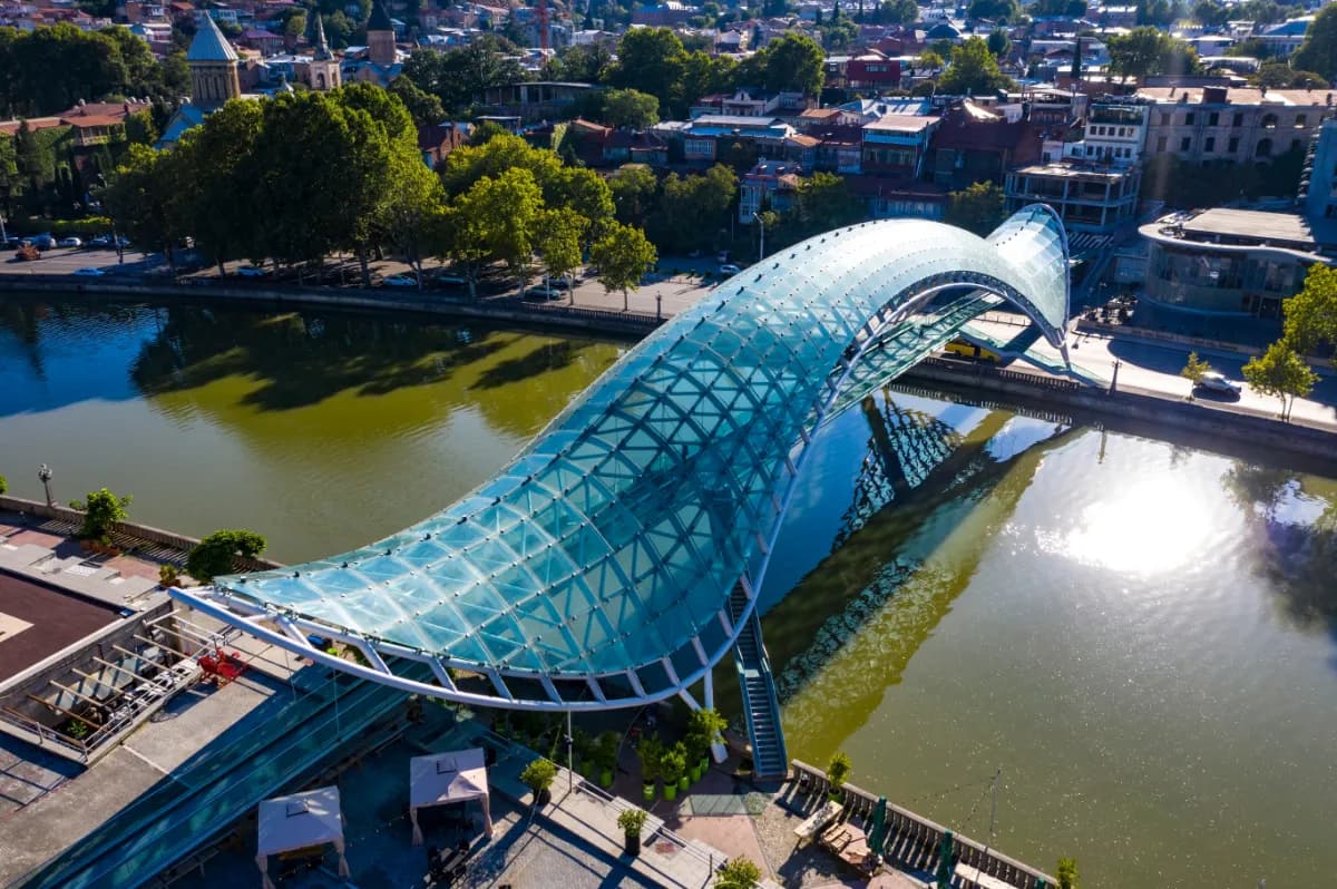 Bridge of Peace modern pedestrian bridge in Tbilisi known for its futuristic glass design, illuminated night views, and connection between old and new city districts.