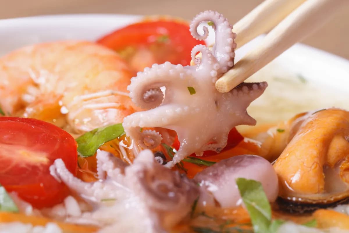 Octopus Curry iconic Seychellois dish made with tender octopus cooked in a rich coconut-based curry with garlic, ginger, spices, and herbs, typically served with rice or lentils.
