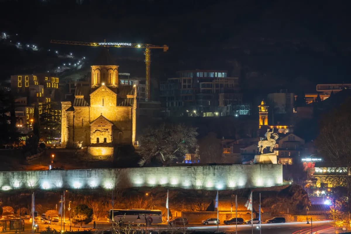 Tbilisi vibrant capital of Georgia known for its illuminated skyline, historic landmarks, riverside views, and lively nightlife atmosphere.