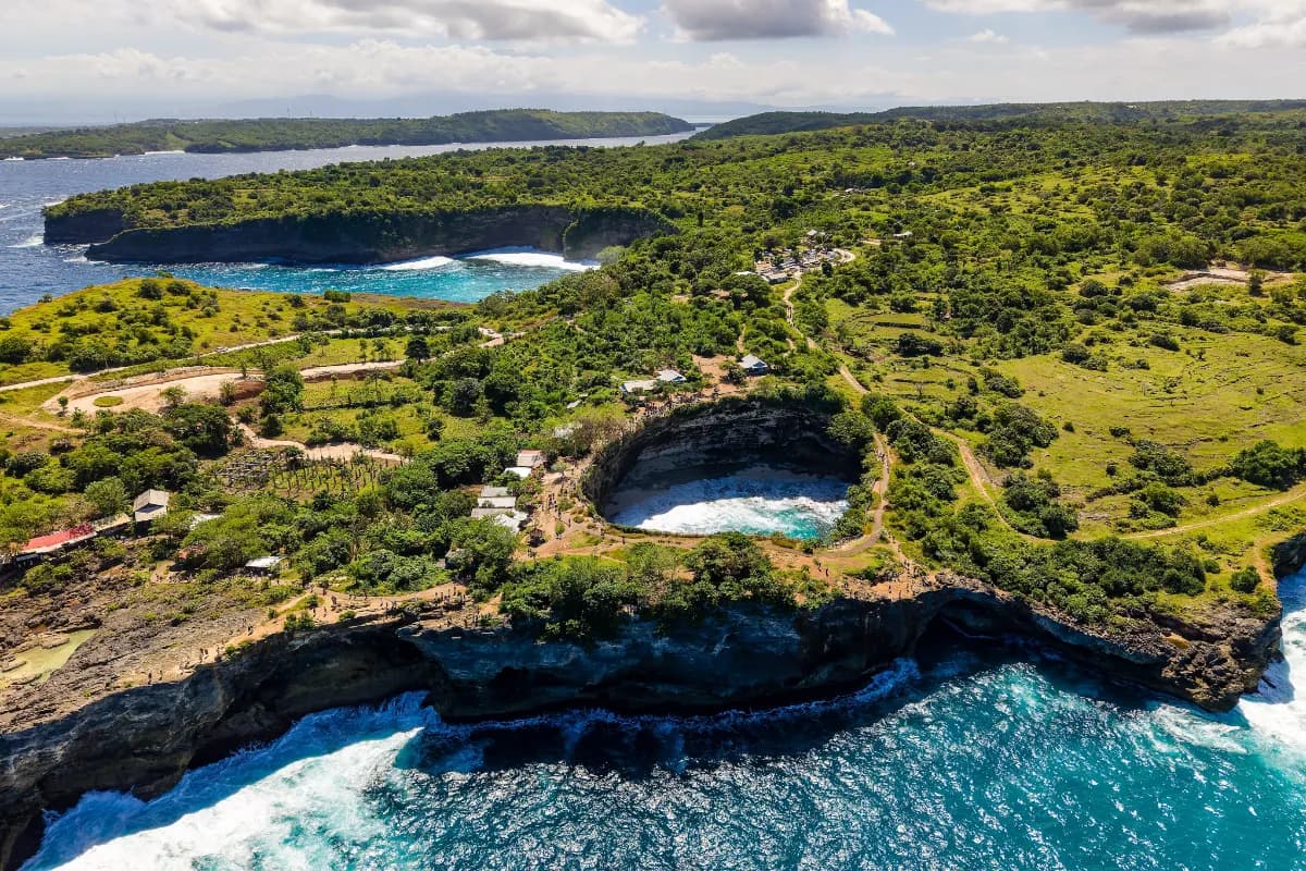 Nusa Penida stunning island near Bali known for dramatic cliffs, crystal-clear waters, pristine beaches, and breathtaking coastal landscapes.