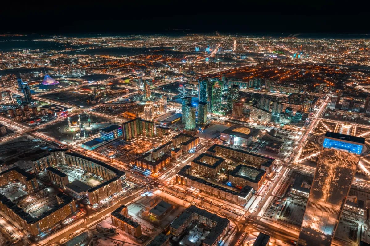 Astana futuristic capital of Kazakhstan known for its illuminated skyline, modern architecture, and striking aerial night views along the Ishim River.