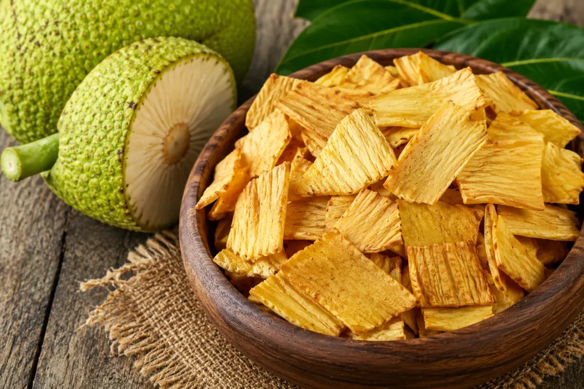 Breadfruit Chips are a crispy Seychellois snack made from thinly sliced breadfruit, lightly salted and fried or baked until golden, commonly enjoyed as a local street-style treat.