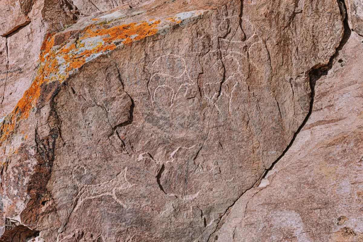 Tamgaly Tas famous rock art site in Kazakhstan known for Buddhist carvings, ancient inscriptions, and scenic riverside landscapes.