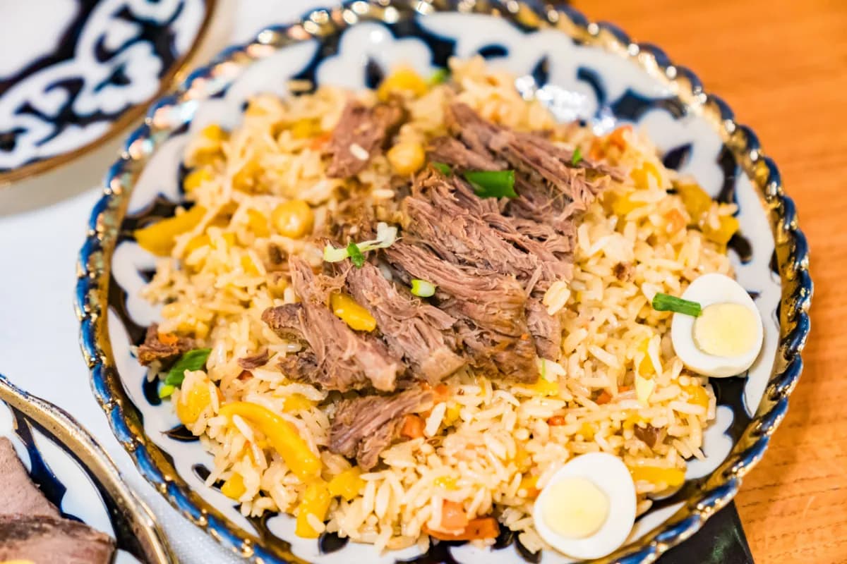 Astana modern capital of Kazakhstan known for its diverse culinary scene, including traditional Central Asian dishes like plov, featuring rice, meat, and spices.